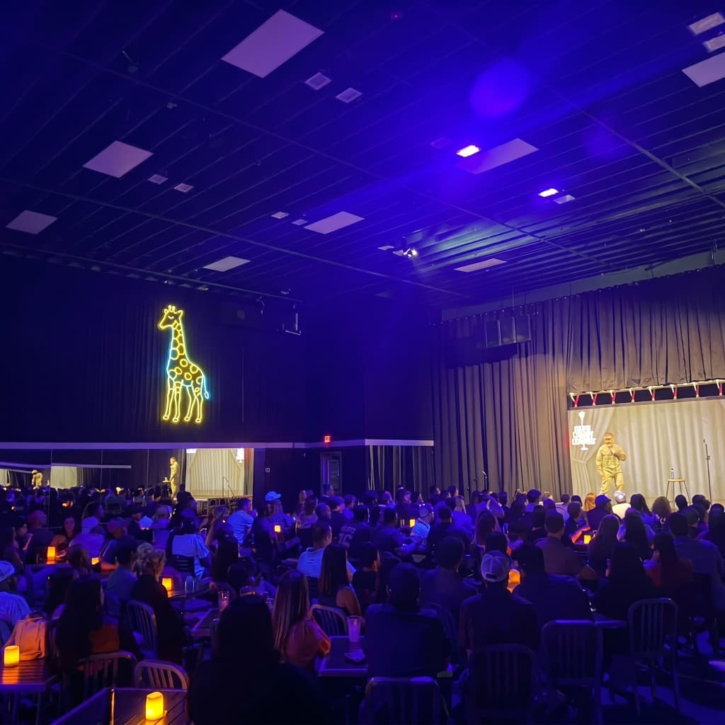 Neon giraffe sign and live comedy at Studio Giraffe, Houston